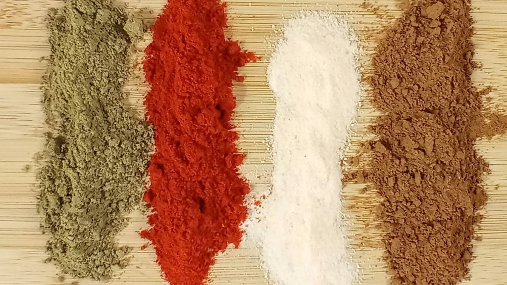 Cleaned spices laid out in rows for grading